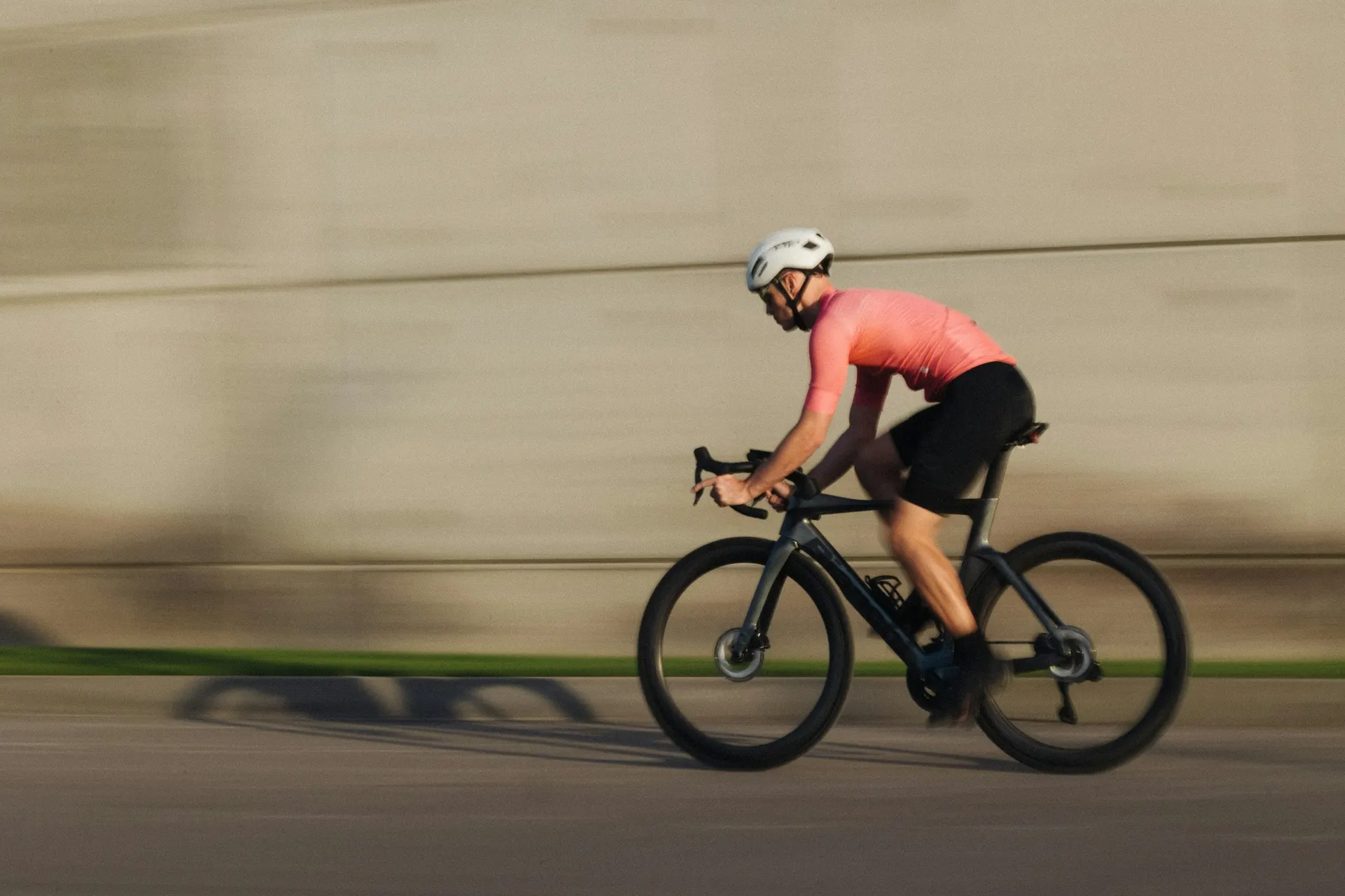Person running or cycling along a path at a comfortable pace