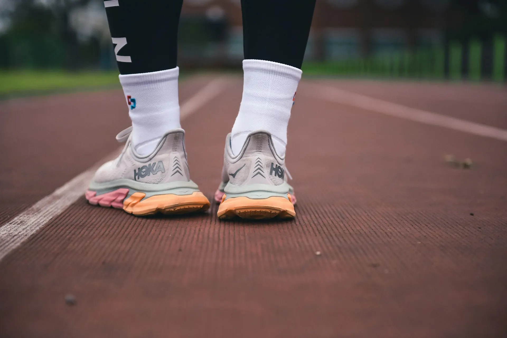 Trainers by the door or a person leaving home for a walk