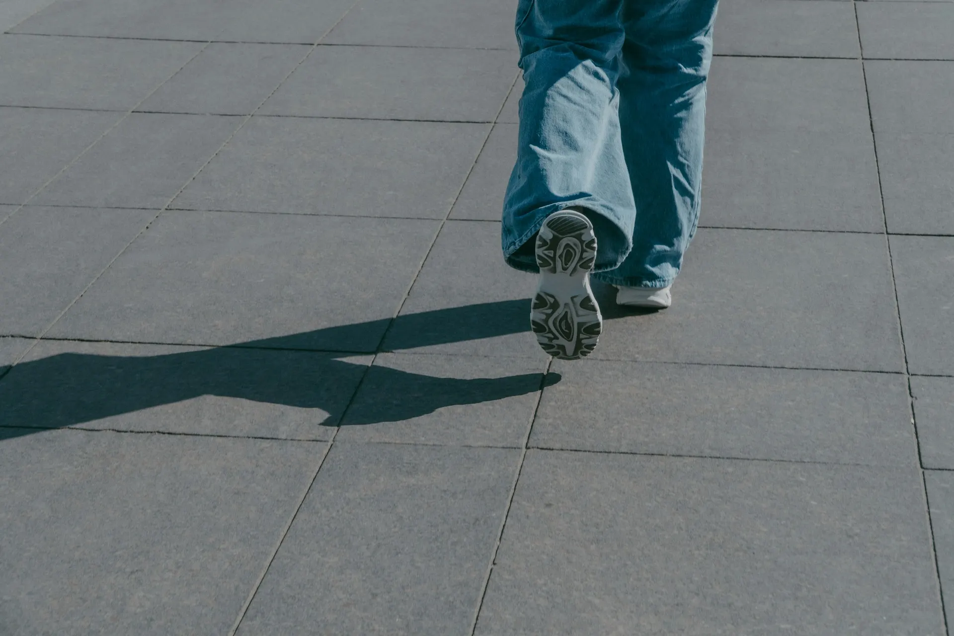 Person walking briskly outdoors